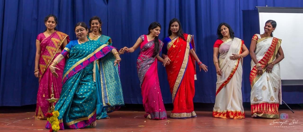 Photo: teachers performing a dance on stage