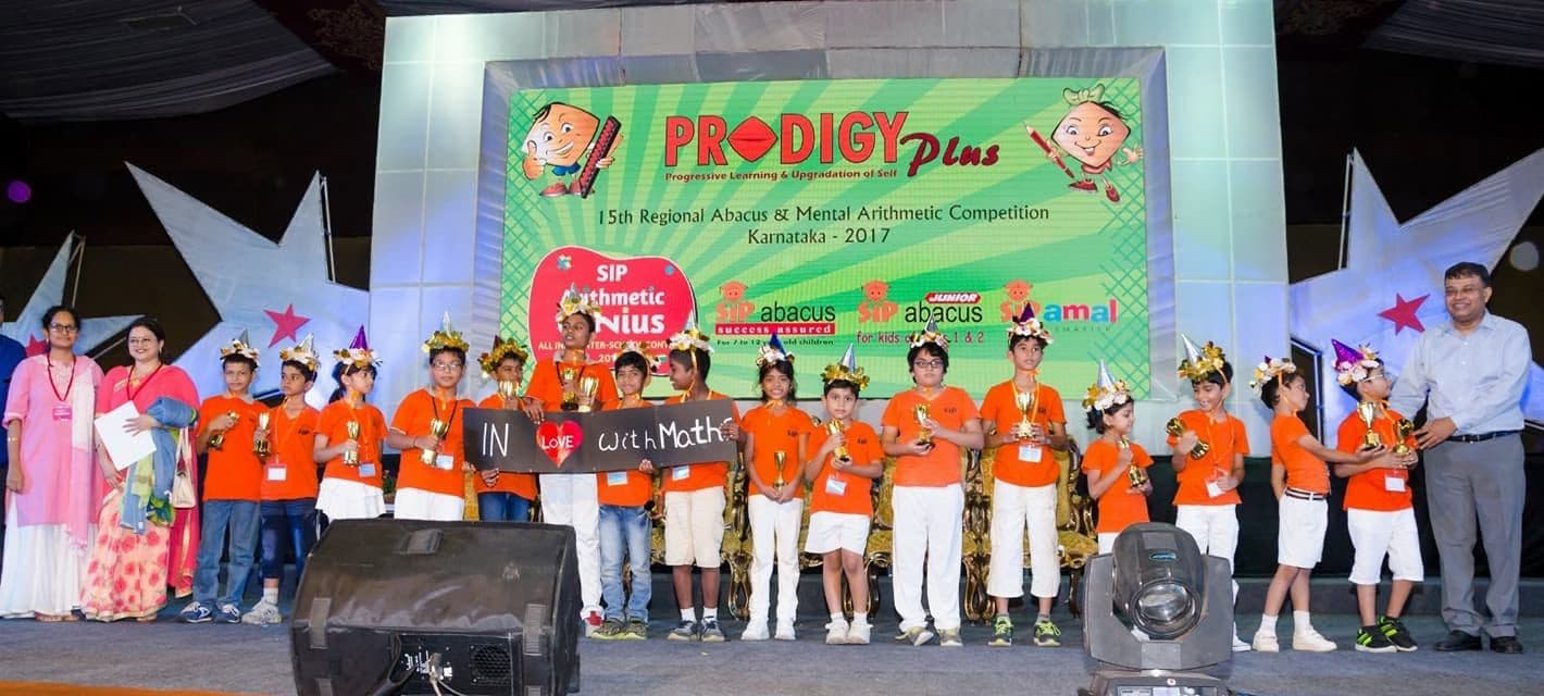 Photo: the first state-level competition, children on stage with trophies