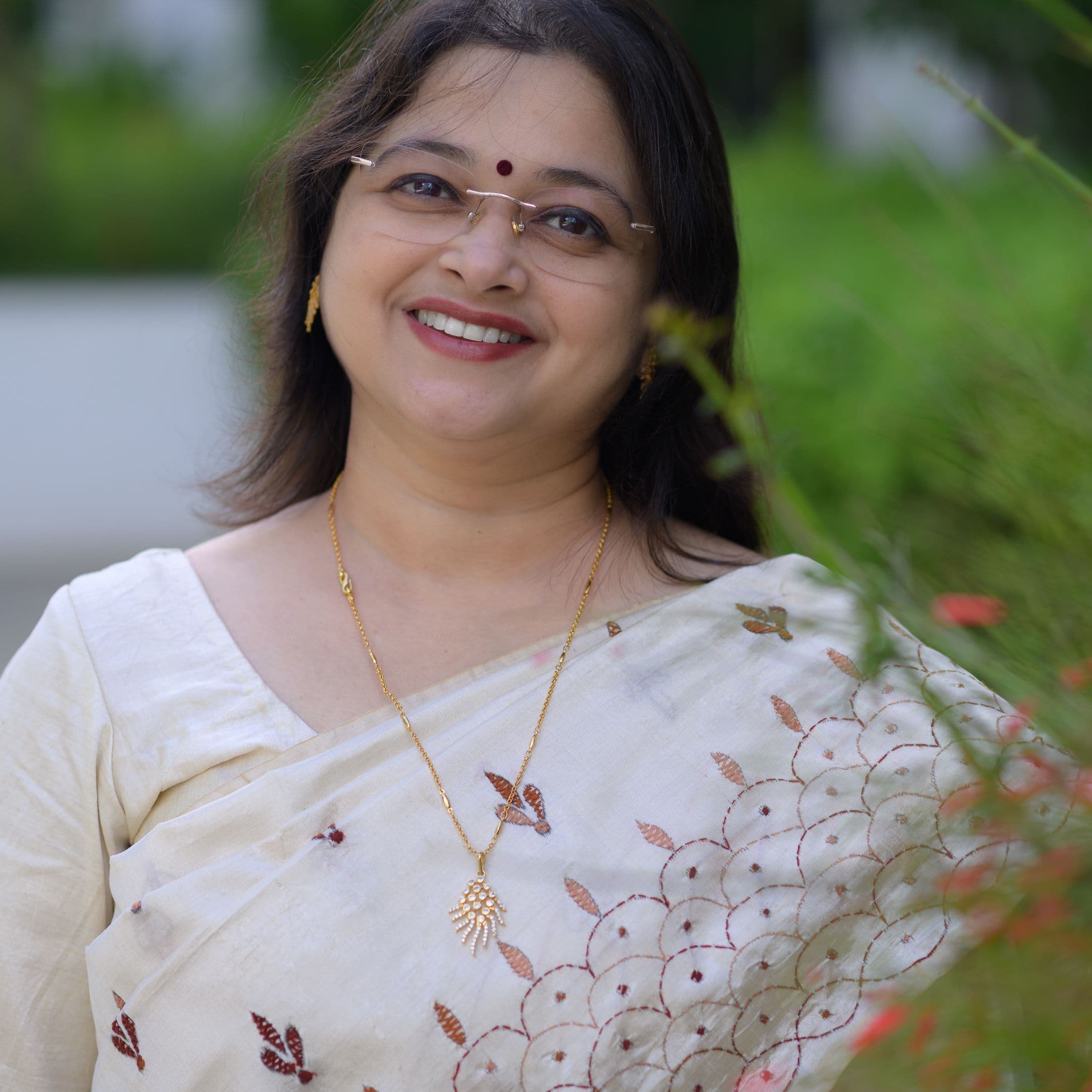 Portrait: Sunitha mid-class, abacus in hand